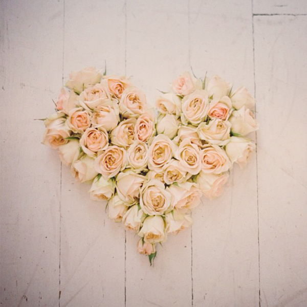 Heart shaped floral arrangement of pink roses, photo Elizabeth Messina Photography